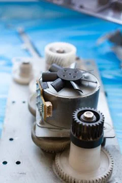 Part of laser printer - block with a electric motor and cogwheels. Foto stock