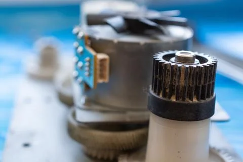 Part of laser printer - block with a electric motor and cogwheels. Stock Photos