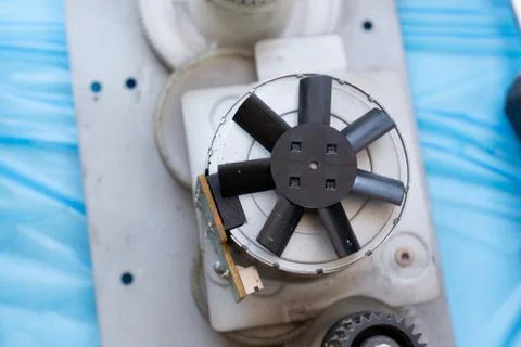 Part of laser printer. Block with electric motor. Closeup view on the impelle Stock Photos