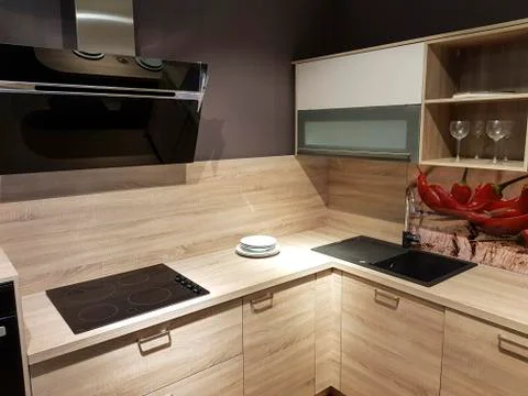 Part of the light brown kitchen under artificial light Stock Photos