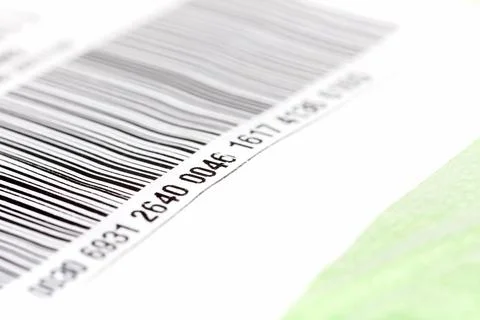 Part of a long barcode label sticker up close, number on a post package parcel 写真素材