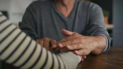 Part of man's hand support his adult daughter Stock Footage 218723208