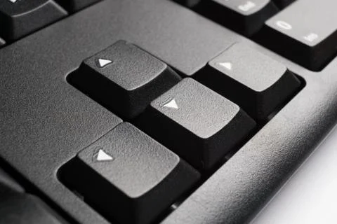Part of modern black computer keyboard with arrow keys Stock Photos