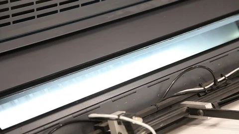 Part of a modern printing machine in the work process Видео 94325129