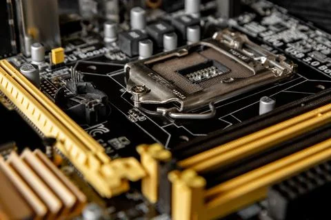 Part of the motherboard with a processor socket and other connectors to Stock Photos