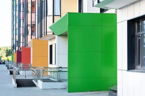 Part of the multi-colored facade of a multi-storey residential building with Stock Photos