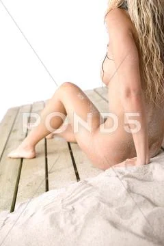 Part Of Naked Female Body On Beach, Woman Sunbathing, Body Covered With Sand