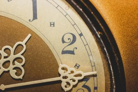 Part of an old clock with Arabic numerals. Stock Photos