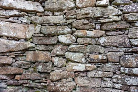 Part of a old stone wall, for background or texture. Stock Photos