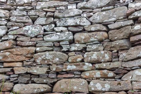 Part of a old stone wall, for background or texture. Stock Photos
