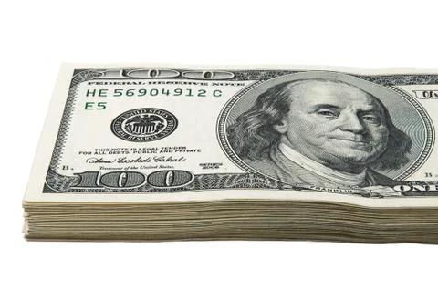 Part of a pack of one hundred dollar bills. View at an angle. Close-up. Isolated Stock Photos