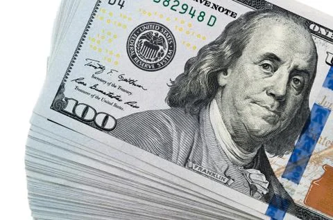 Part of a pack of one hundred dollars with a shift. Close-up. Isolated. Stock Photos