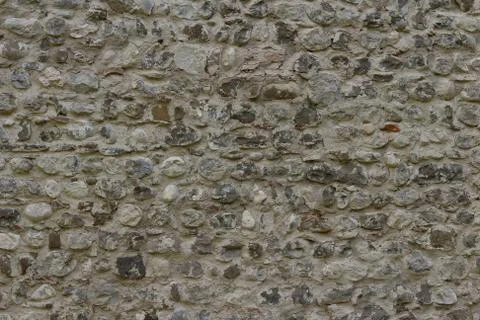 Part of a pebble wall, for background or texture. Stockfoto's