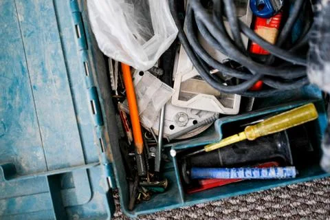 Part of a plastic toolbox. Builder carry case. A mess of different little things Foto stock