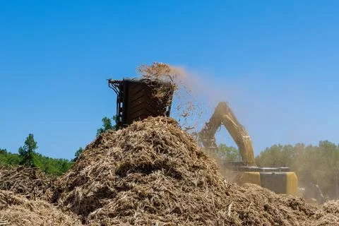 As part of the preparation for a housing development, a shredder machine is used Stock Photos