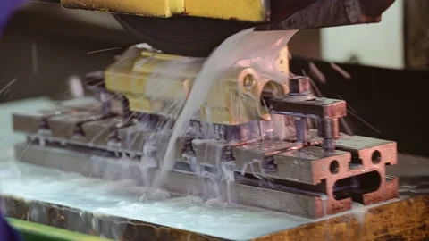 The part is processed on a water-cooled machine. The bed moves from side to side Stock Footage 213726317