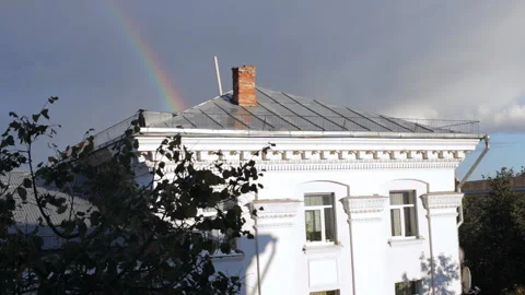 Part of the rainbow behind the building Stock Footage 96202887