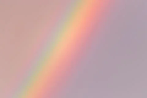 Part of the rainbow going from top to bottom on the left side of the photo Stock Photos