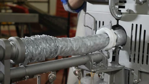 A part of sausage producing machine. Automatic line in meat factory. Meat Stockbeeldmateriaal 102779305