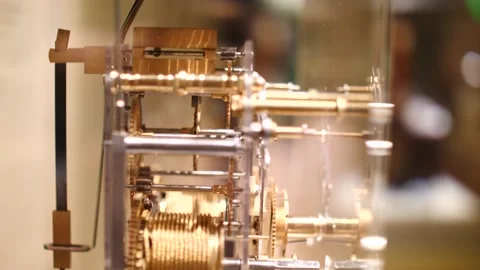Part of a skeleton clock mechanism showing the brass workings Stock Footage 151502998