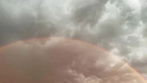 Part of sky with storm clouds and rainbow, time-lapse Stock Footage 337654681