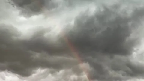Part of the sky with storm clouds and rainbow Stock Footage 337654698