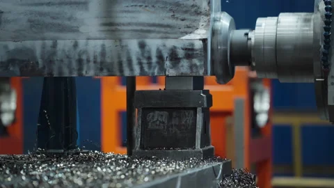 A Part of the Smoothing Machine is pressed against the metal product at Factory Stock Footage 158288382