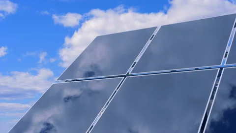 Part of a solar array located outdoors is mirroring clouds Stock Footage 93445519