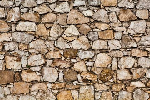 Part of a stone wall . Background or texture Stock Photos