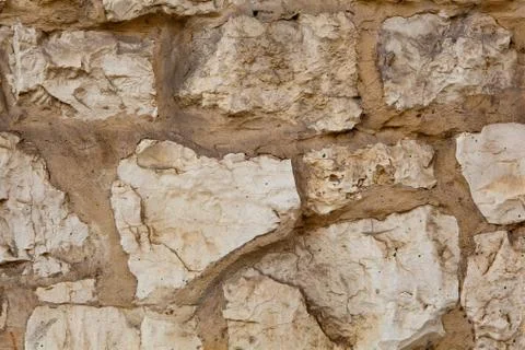 Part of a stone wall . Background or texture Stock Photos