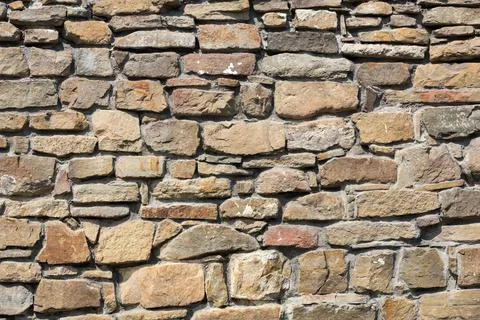 Part of a stone wall, for background or texture. Stock Photos