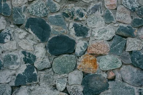 Part of a stone wall, for background or texture. Detail of stone wall. Close Stock Photos