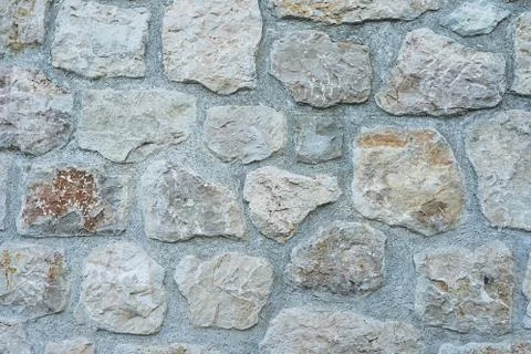 Part of a stone wall, stone texture. Stock Photos