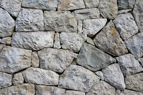 Part of a stone wall, stone texture. Stockfoto's
