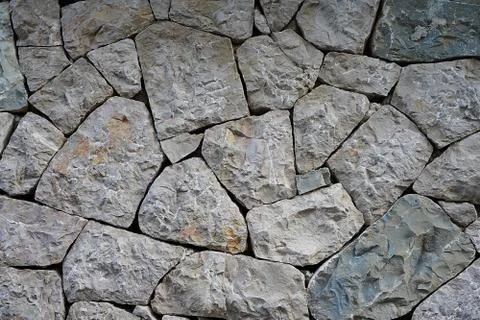 Part of a stone wall, stone texture. Stock Photos