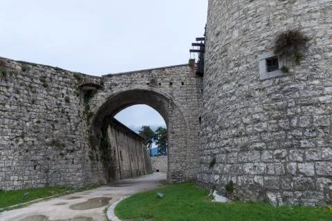 Part of a tower and a gate conneting to the wall of Brescia castle Stock Photos