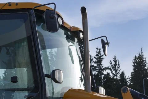 Part of the tractor, cabin, mirror in front, wipers and headlights. Exhaustin Foto stock