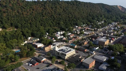 Part two of a fast aerial orbit around Berkeley Springs, West Virginia on Stock Footage 117433569