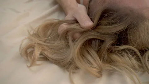 Part view of a man's hands caressing a woman's bare back Stock Footage 89108556