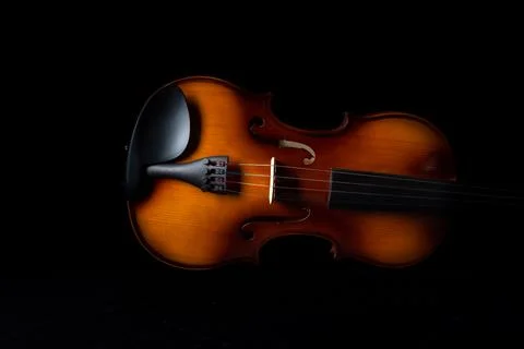 Part of the violin on a dark background. Stock-Fotos