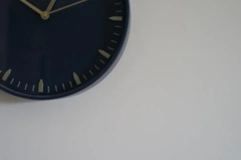 Part of a wall black clock on beige background Clock on the wall Concept of time 스톡 사진