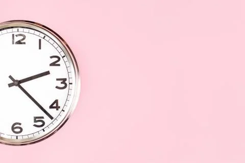 Part of wall clock on candy pink background Stock Photos