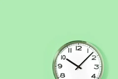 Part of wall clock on pastel mint background Stock Photos