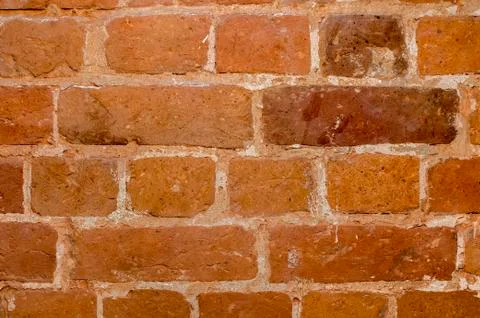 Part of the wall of an old house inside of red brick close up. Background 写真素材