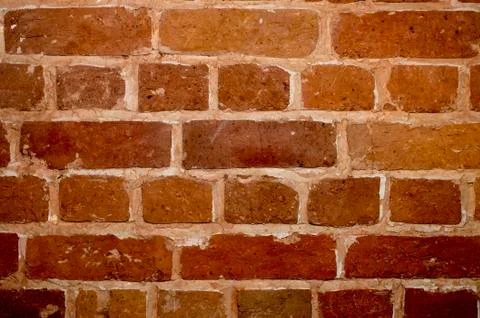 Part of the wall of an old house inside of red brick close up. Background 写真素材