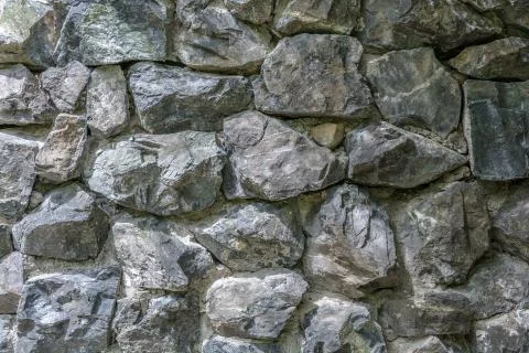 Part of wall from rocks. background Stock Photos