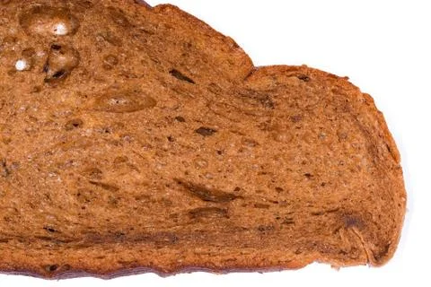 Part of wheat-rye brown bread slice, texture close-up Stock Photos