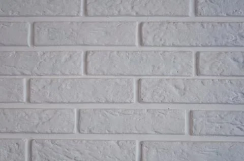 Part of a white brick wall in an interior Stock Photos