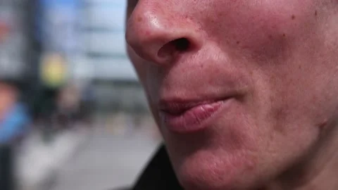 Part of a woman's face, lips close-up. Conversation Stock Footage 209690147