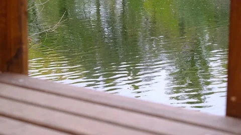 Part of wooden empty bridge on a flowing river background. Stock Footage 142818675